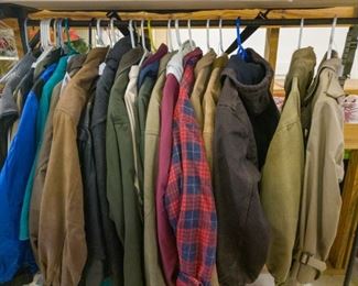 Lots of men's coats and jackets