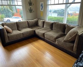 Andre Agassi for Kreiss Collection leather and upholstered sectional.  Each piece is 42"d x 30"h at the back.  The length into the room is 133 on one side and 108 on the other - this is measuring from the wall both directions.  Sectional can be shortend by 28" removing one piece so each section is roughly 108" each coming into the room.  $1200