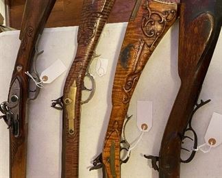 In no particular order...Earl Laning Contemporary Maple Custom Flint Lock, G.L. Jones Muzzle Loader, Douglas Kentucky Rifle, Muzzle Loader Henry Barrel