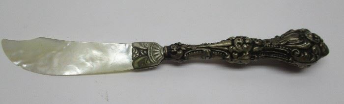 Victorian Art Nouveau letter opener with ornate sterling handle and mother of pearl blade.  5.75" long.  Blade has come loose