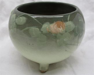 An unsigned Arts & Crafts footed pottery bowl.  Hand painted.  Green glaze on top fading to white on the base.  3.75" tall