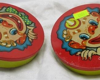 Pair of T.Cohn Inc tin litho clown noise makers.  Made in USA.  4" diameter.  Some paint wear from use
