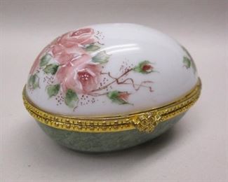 A porcelain egg shaped trinket box with perfume bottle inside.  Hand painted with rose blossoms motif.  Hand signed Renshaw.  3" wide