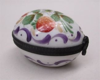 A vintage hand painted Peint Main Limoge France trinket box in the shape of an egg.  1 7/8" long, 1 3/8" wide