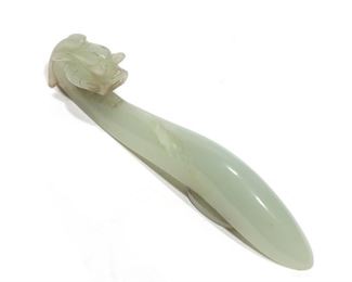 Lot 84 | CHINESE QING DYNASTY CELADON JADE BELT HOOK