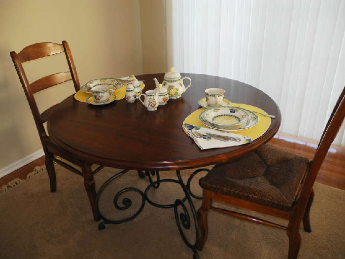 This dinnette set with iron base has six chairs