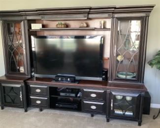 This very clean entertainment center/wall unit is available for pre-purchase by calling or texting Smitty at 410-336-0277. Additional photos and dimensions are at the very end of the photos for the sale. Unit comes apart in several sections for hauling.
