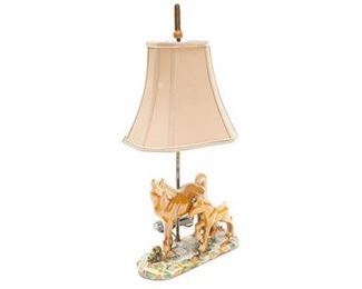 Table top lamp with a porcelain horse base, painted and glazed, in working order, with shade.