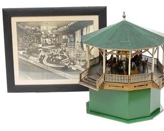 Vintage wooden carousel model w/ photograph, in working condition, hand painted, framed photograph.
33"h x 33"d