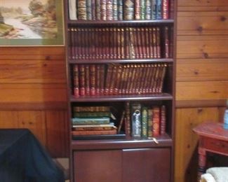 mah bookcase w/ leather bound books