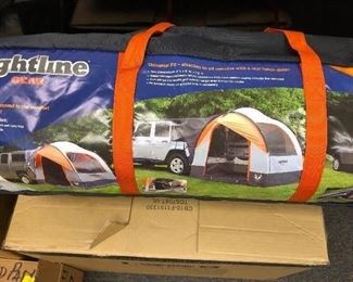 New in box tent - attaches to back of SUV with lift hatch