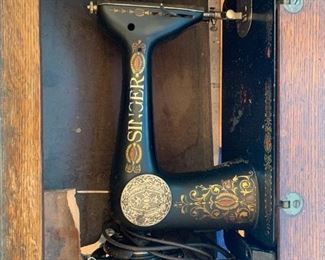 Antique Singer sewing machine with solid wood table