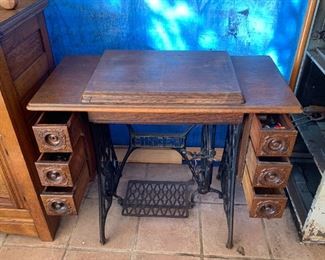 Antique Singer sewing machine with solid wood table