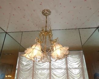 multiple crystal chandeliers throughout
multiple wall sconces