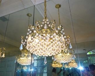 multiple crystal chandeliers throughout
multiple wall sconces