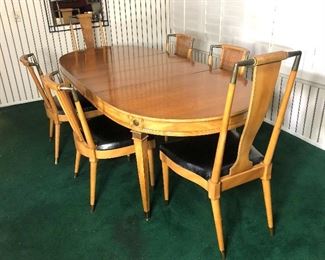 Lot #6, Picture 1. Price $1499. Beautiful Mid Century  Dining Set including Table + 2 Leaves, 6 Chairs, and Protective Leather Pad.  This set is in Very Good Condition for its age. Very few marks on this set and black vinyl chair seats have no rips. It has been lovingly cared for. Excellent Quality! This picture is the full sized table with leaves and 6 Chairs. Dimensions:  88” x 39” with 2  leaves, w/o leaves 58”, low  chair 20w x 17 x 34, tall chair 20 x 17 x 41.5. Not Subject To 25% Discount