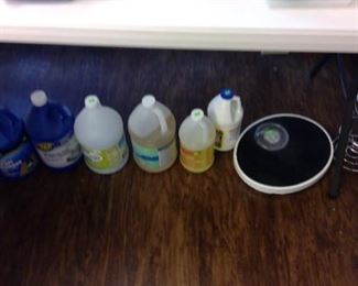 Cleaning supplies, bathroom scale, toilet paper holder