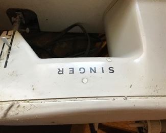 Singer sewing machine in cabinet