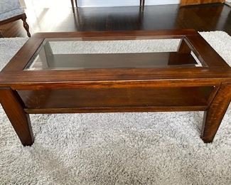 Glass insert coffee table with under shelf. 