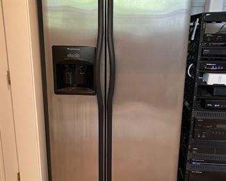 Frigidaire side by side Stainless Steel Refrigerator.  Doors will need to be removed to exit house.