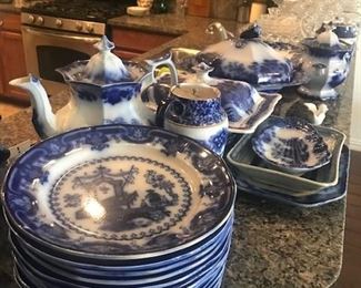 12 matching large Flow Blue Plates, Teapot, covered tureens, platters, large covered jar.  