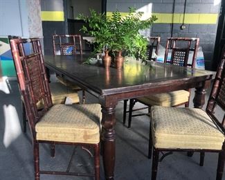 Never been used table, however some damage on top corners due to moisture. But very solid.  Can be refinished. Chairs are vintage Kornmyer faux bamboo, set of 6.  I'd paint the chairs and recover seats for a beautiful contemporary and trending look. 