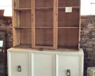 Vintage hutch for a DYI'er.  Top is already sanded, and bottom has been primed. Has three top doors and need glass for center.  Great brass pulls.  