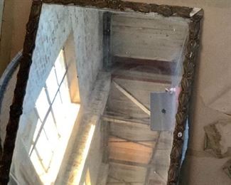 Antique guilt mirror.  Needs a little gold leaf paint touch up. 