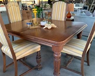 Antique dining table, likely over 100 years old. Antique chairs in need of upholstery and perhaps painted wood.  don't let water damage fool you, upholster takes all of this off! Can be like brand new!
