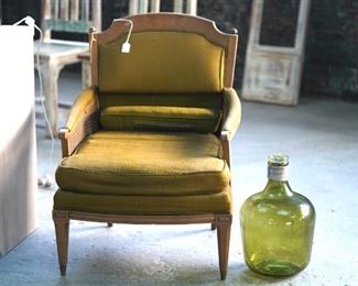 Antique wood and upholster chair.  I'd paint the wood and put some fab fabric on this to be a knockout!