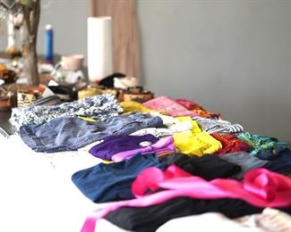 Assorted women's shorts, leggings, and yoga wear. 