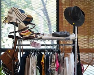 Assorted jackets, cotton shirts, and pants, hats, jeans. 