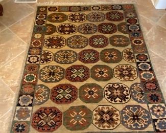 $125.00 wool Patterned rug Approximately 3 1/2 x 5