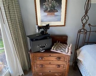$125.00 Victorian 3-drawer chest displaying onyx chess set and nice Singer Featherweight machine in case.