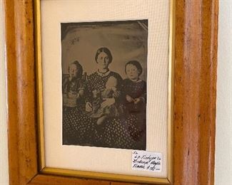 Large tintype of family in Birdseye maple frame