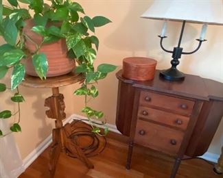 Plant stand $35.00 and a Martha Washington sewing stand $95.00