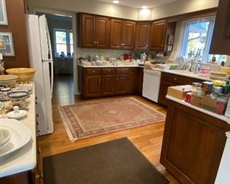 Overview of kitchen cabinets being sold as a Bid item. 