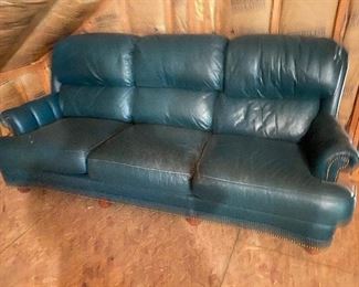 Teal leather sofa, some wear