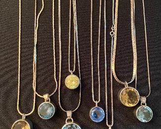 Topaz, Citrine, Aquamarine & other faceted pendants on chains, all by Avis (designer)