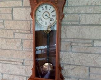 Wall clock with pendulum.