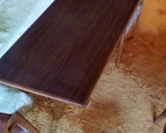 Shot of the wood of the table and chairs.