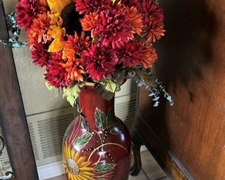 One of two vases and arrangements