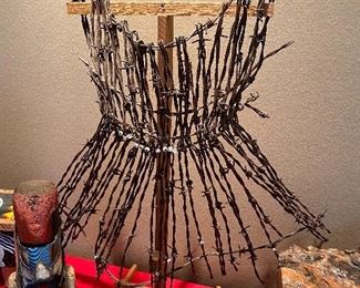 "Restrained" A dress made of Barbed wire, kinda appropriate for the time.