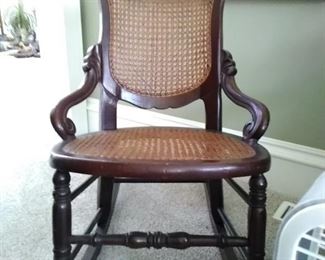 19. $60. Wood Caned Rocking Chair
(MB)