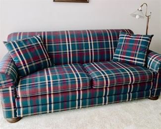 Plaid sofa sleeper, floor lamp
