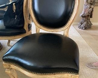 Hand carved XVI chair with black leather upholstery 