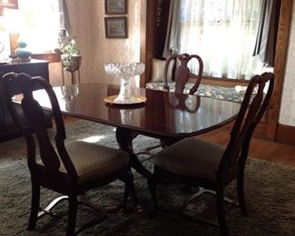 Dark Mahogany table with 6 chairs. A matching china hutch. This dining set is not real large. 