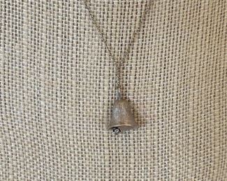 45/ $65 - 14kt white gold necklace with bell pendant 0.078 ounces 