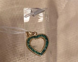 73. $95 - 14kt yellow gold heart with emeralds 