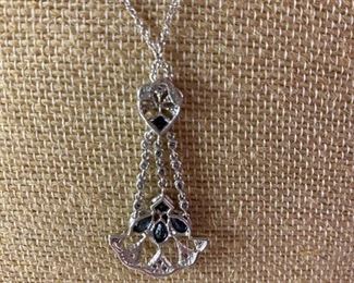 113- $250 - 14kt white gold pendant fan style with sapphires. Chain included. 0.170oz or 4.85 grams. 1 1/2” T x 3/4”w